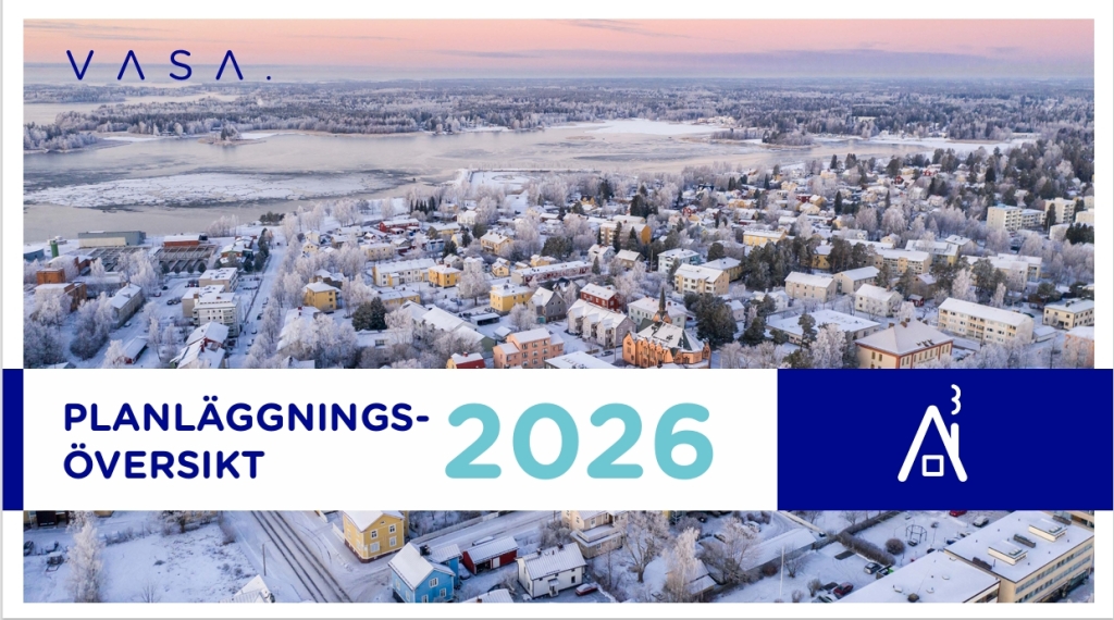 En flygfoto över staden en frostig vinterkväll, träden är täckta av frost och himlen är rosa.