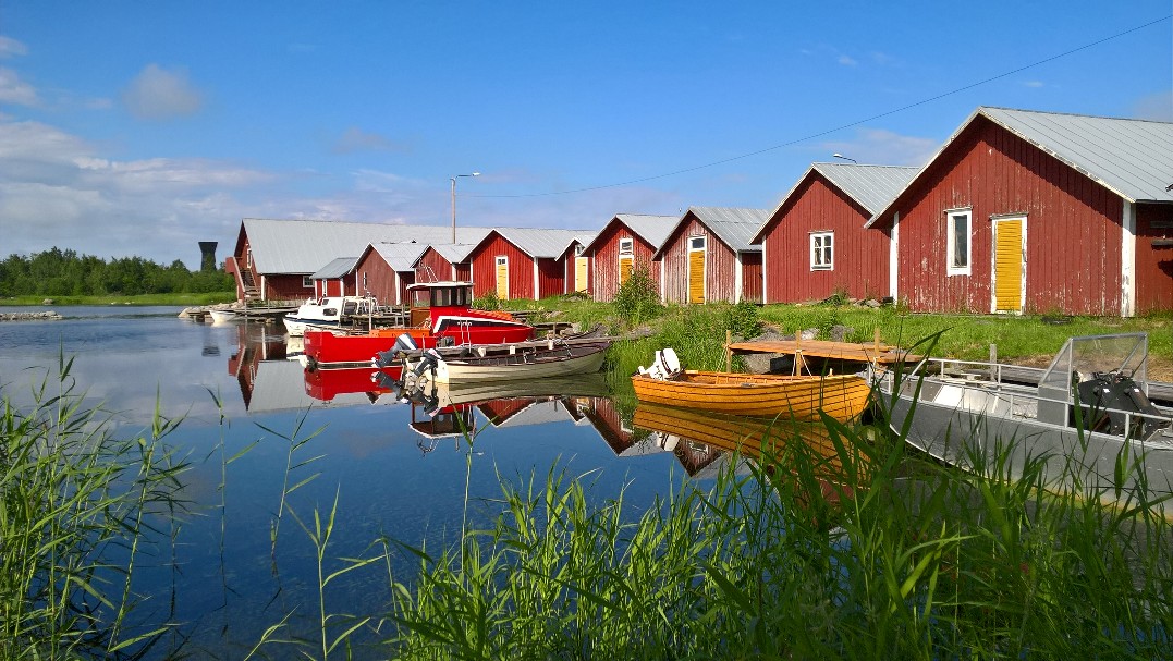 Svedjehamn's red boathouses are idyllic sight. 