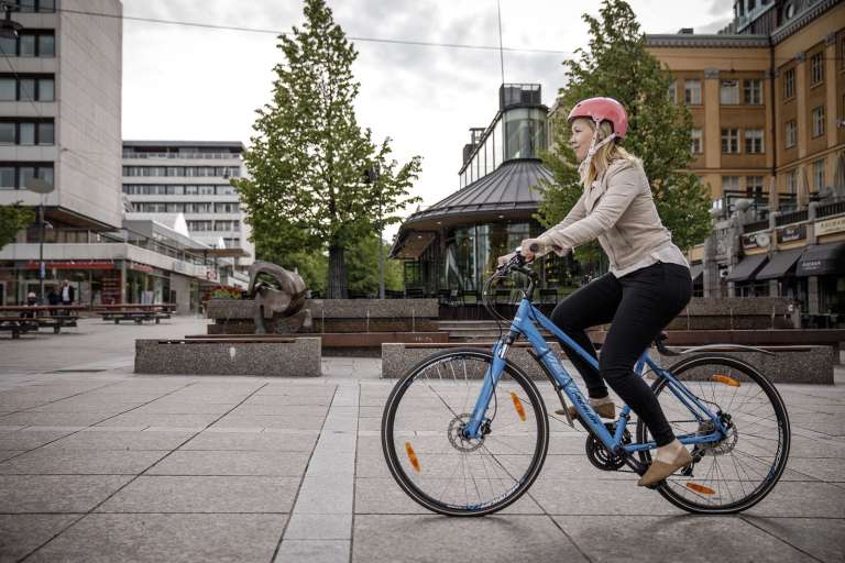 Girl bikes on the street