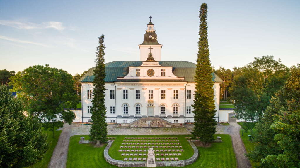 A white church building, in a park area