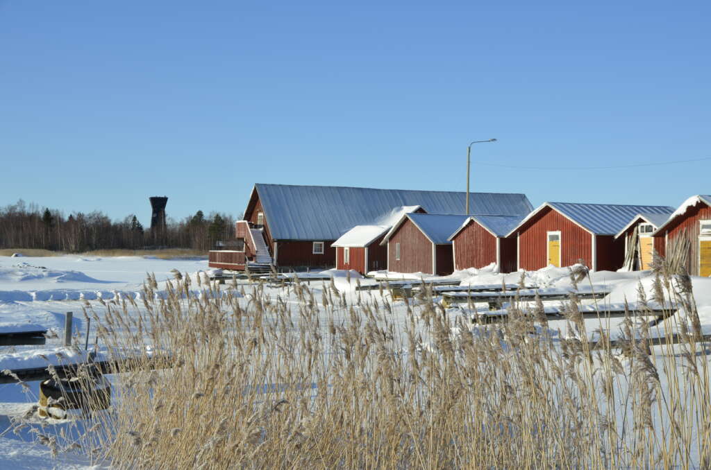 Red boat houses in winter