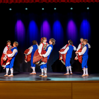Children dancing in traditional clothes.